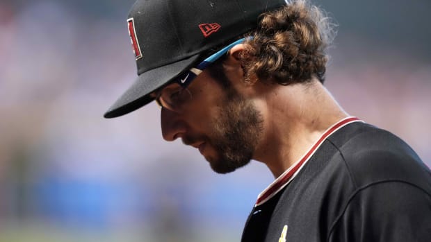 Arizona Diamondbacks right-hander Zac Gallen looks down to the mound during the third inning in a game against the Baltimore Orioles at Chase Field.
